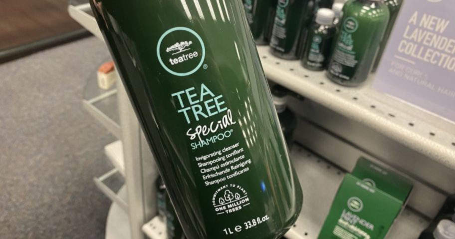 paul mitchell shampoo liter in hand in store