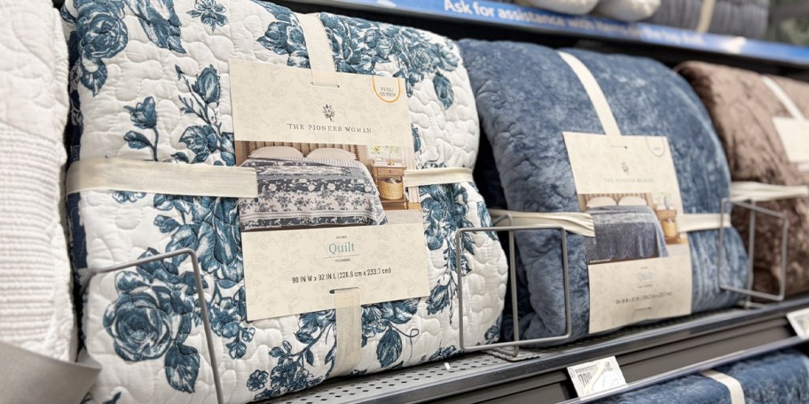 blue and white floral quilts on shelf 