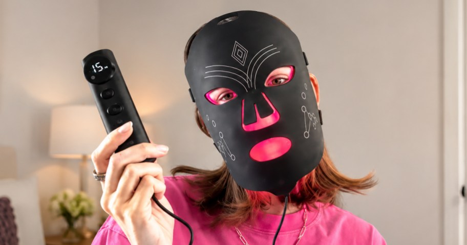 woman wearing red light therapy mask
