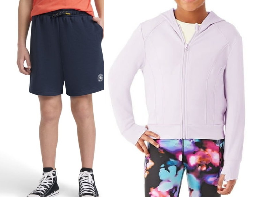 Two children modeling clothing side-by-side: one wearing navy blue shorts and black high-top sneakers, and the other wearing a light purple zip-up jacket and colorful patterned leggings.