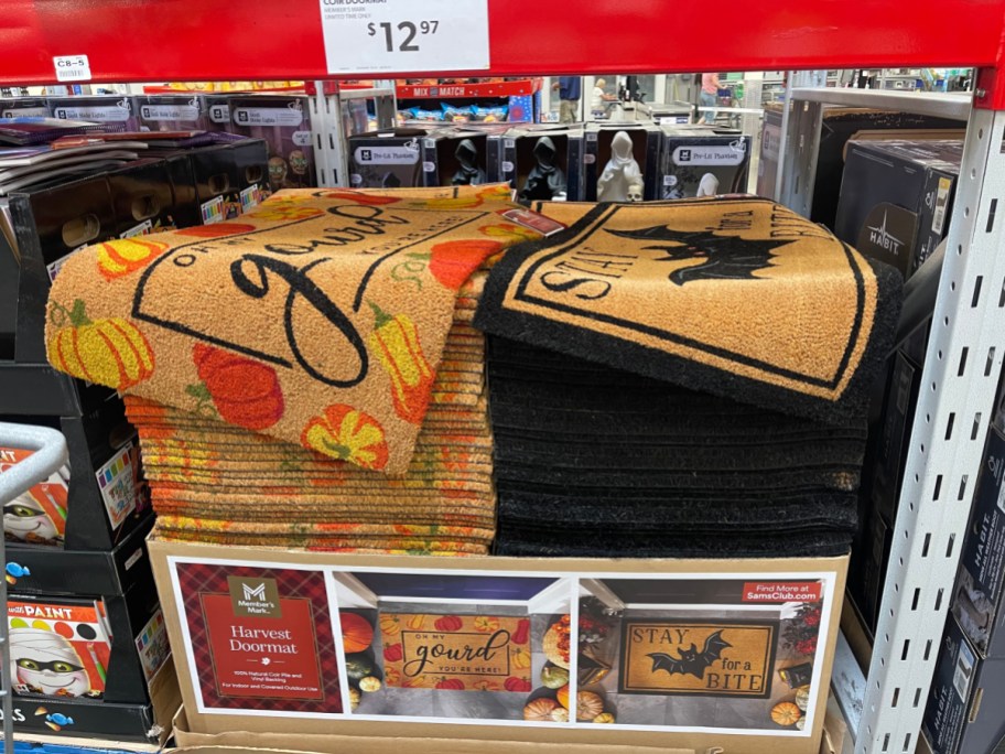 Member's Mark Harvest coir doormats featuring pumpkin and bat designs on display at Sam's Club for $12.97.