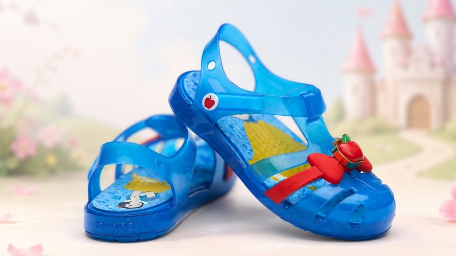 a pair of crocs snow white sandals