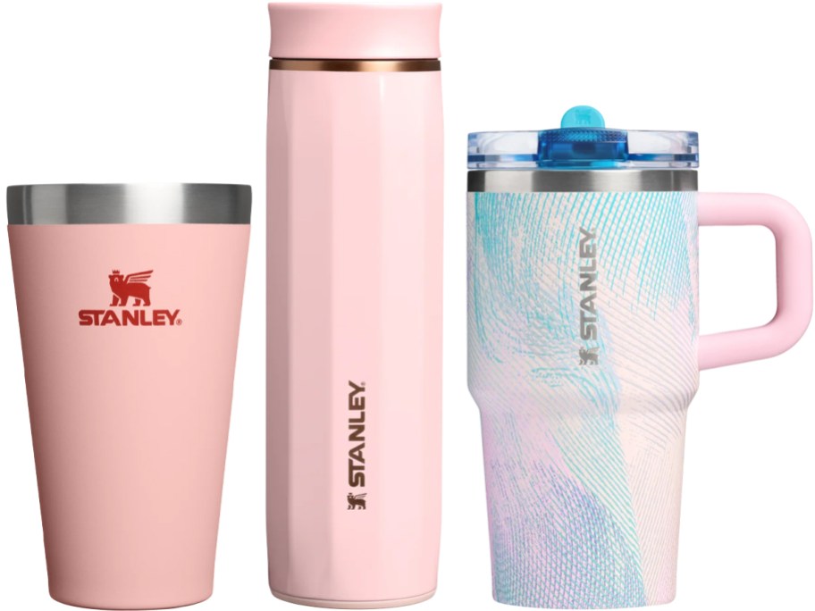 two pink and one multicolored tumblers and cups
