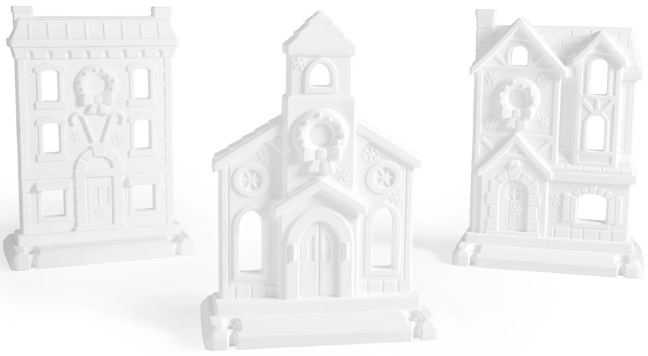 three large white christmas village decor pieces 