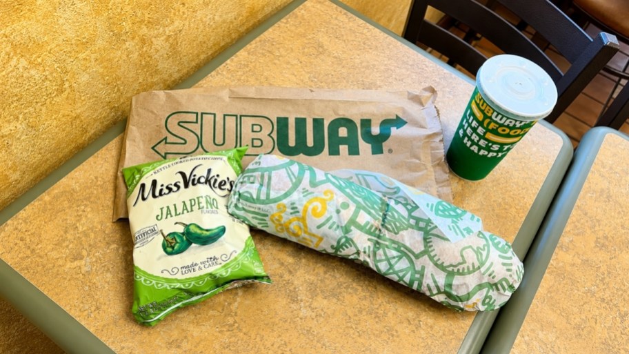 subway combo with with pickle chips, a foot long, and a fountain drink