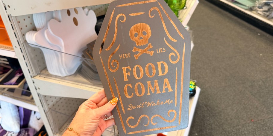 hand holding tombstone charcuterie board 