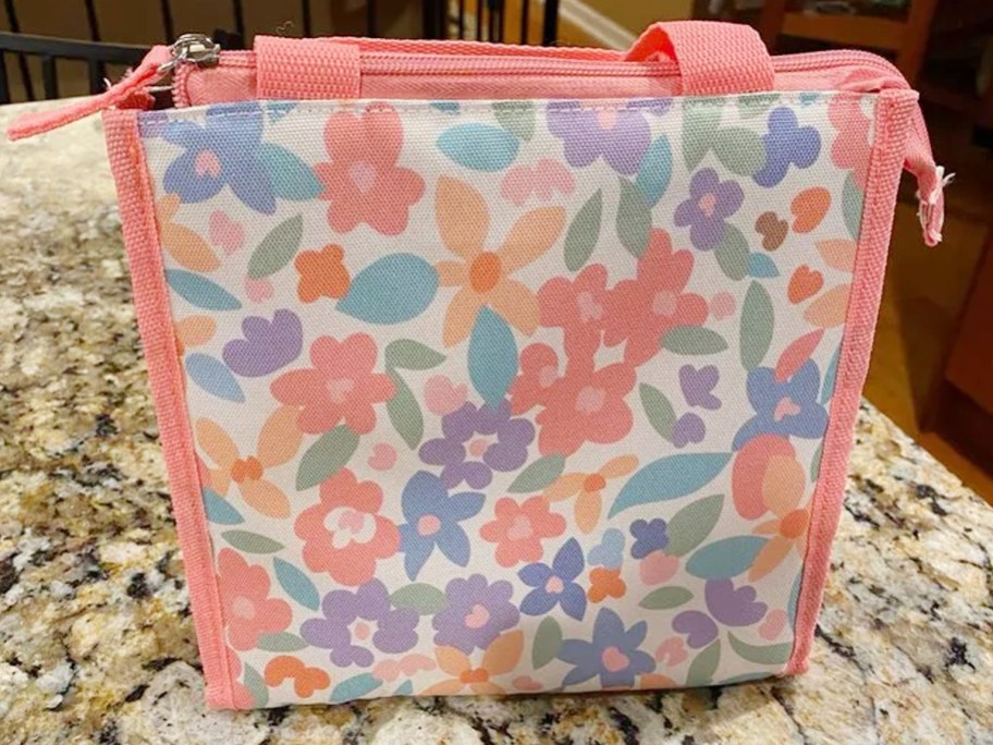 pink floral lunch bag on counter