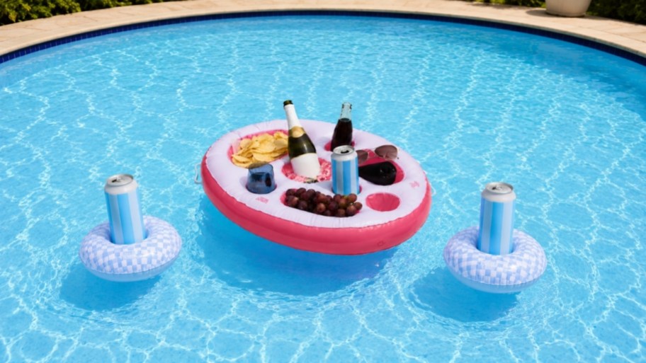 thyme and table drink floaties and serve tray in a pool