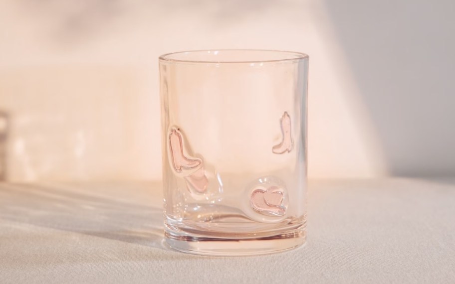old fashioned glass with cowboy boot icons