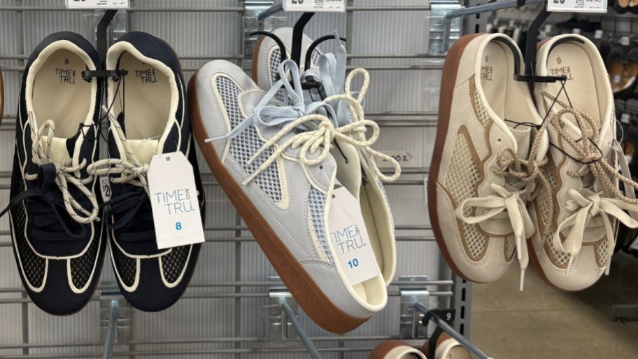 sneakers on a display wall in a store