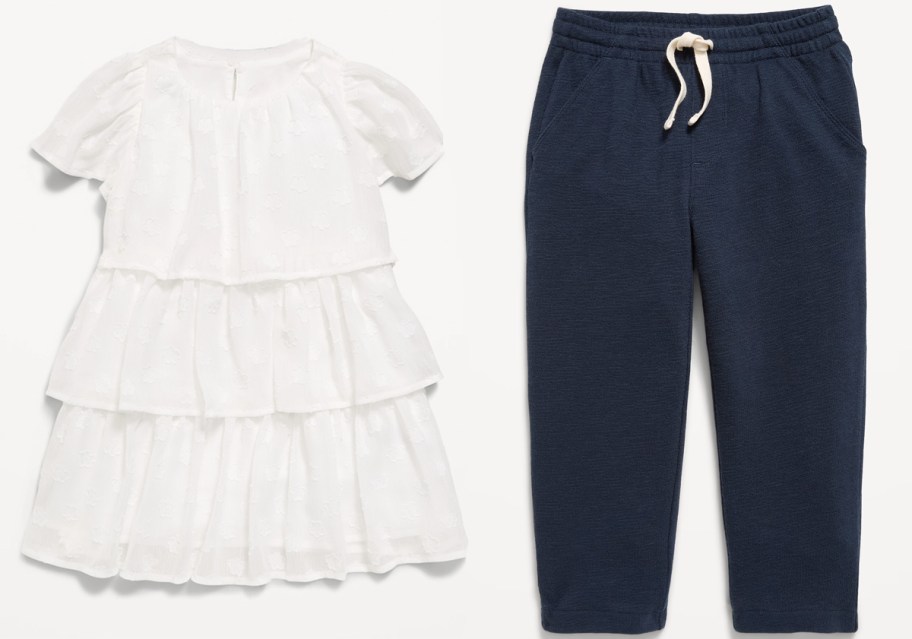 white toddler dress and blue sweatpants 