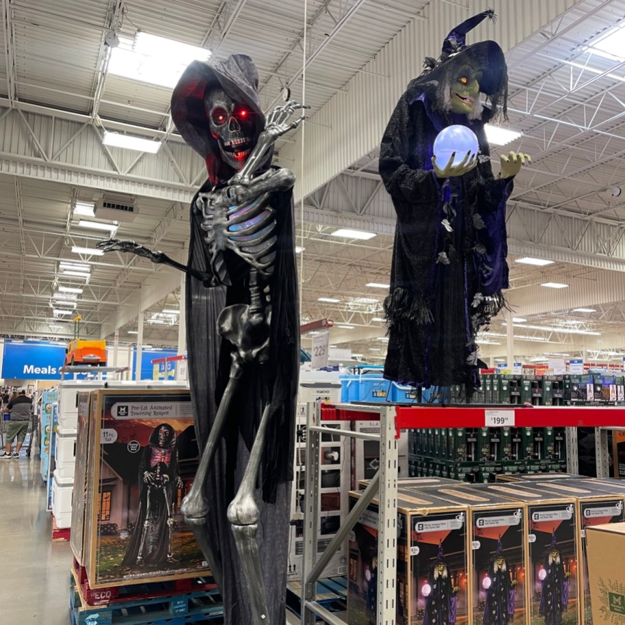 tall animated grim reaper and witch figures at Sam's Club