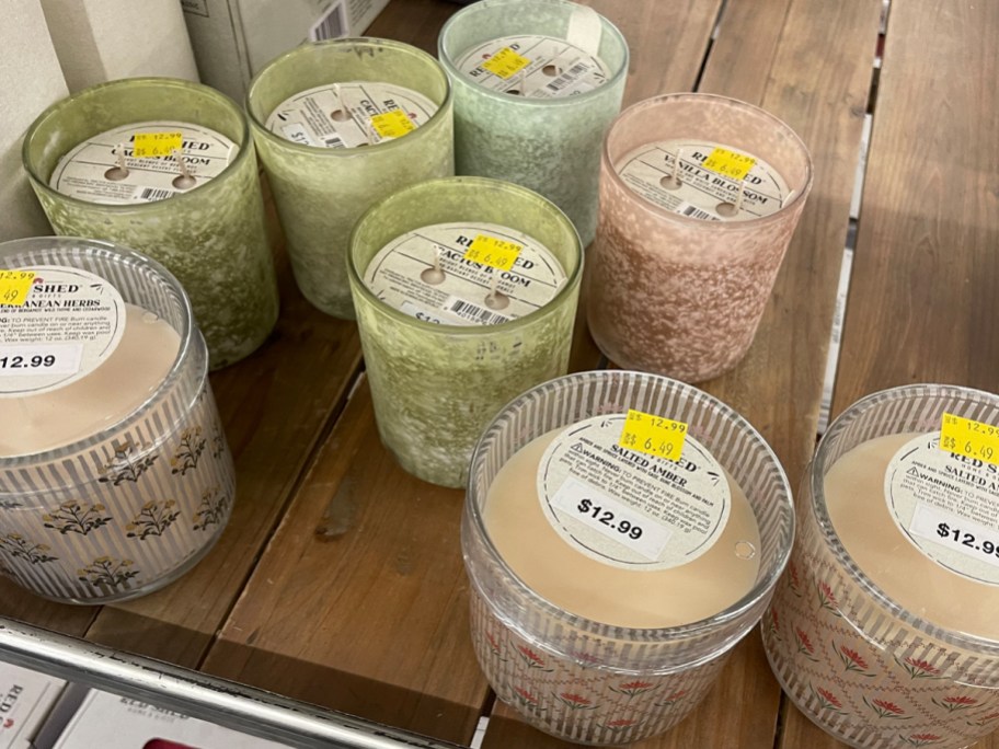 green and pink candles on shelf