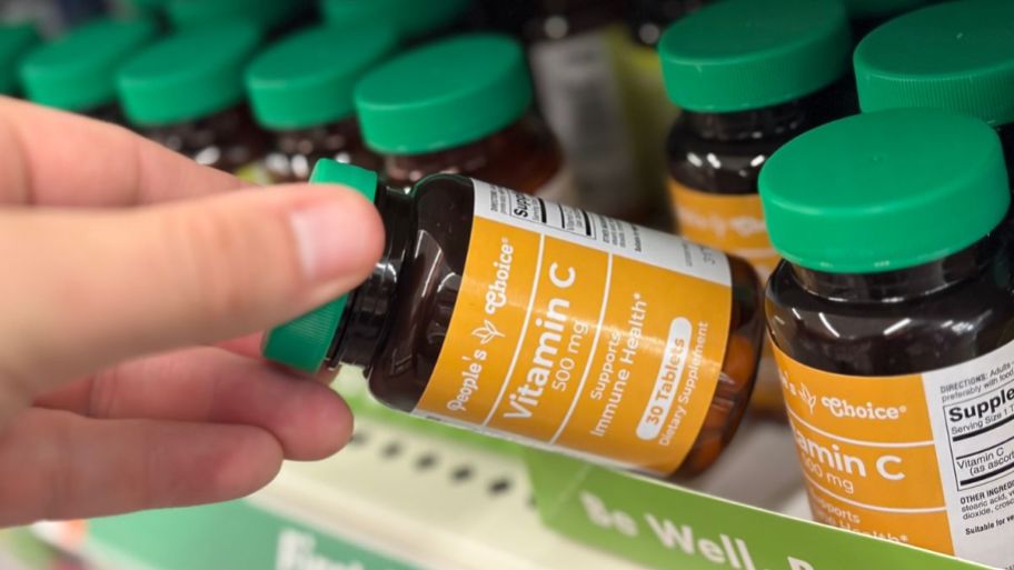 person holding Dollar Tree Vitamin c