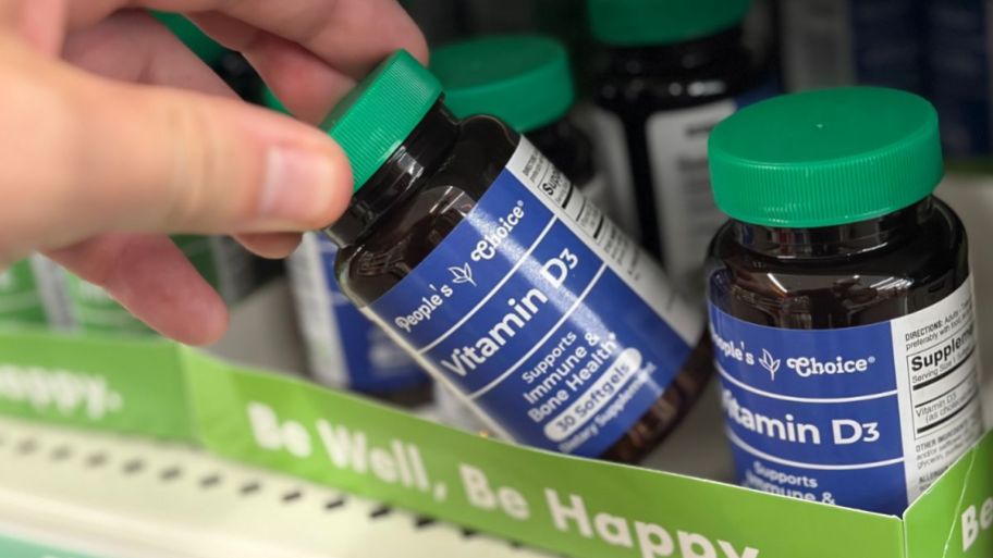 Hand holding dollar tree vitamin d3