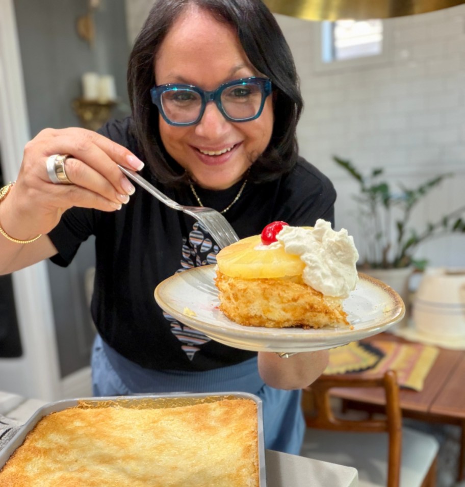 woman holding a slice of pineapple angel food cake