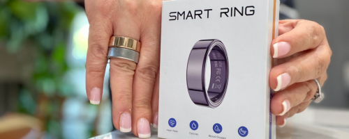 woman wearing an amazon smart ring and an oura ring