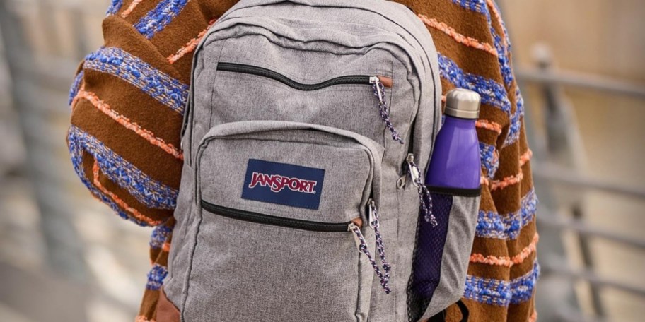 kid wearing gray backpack