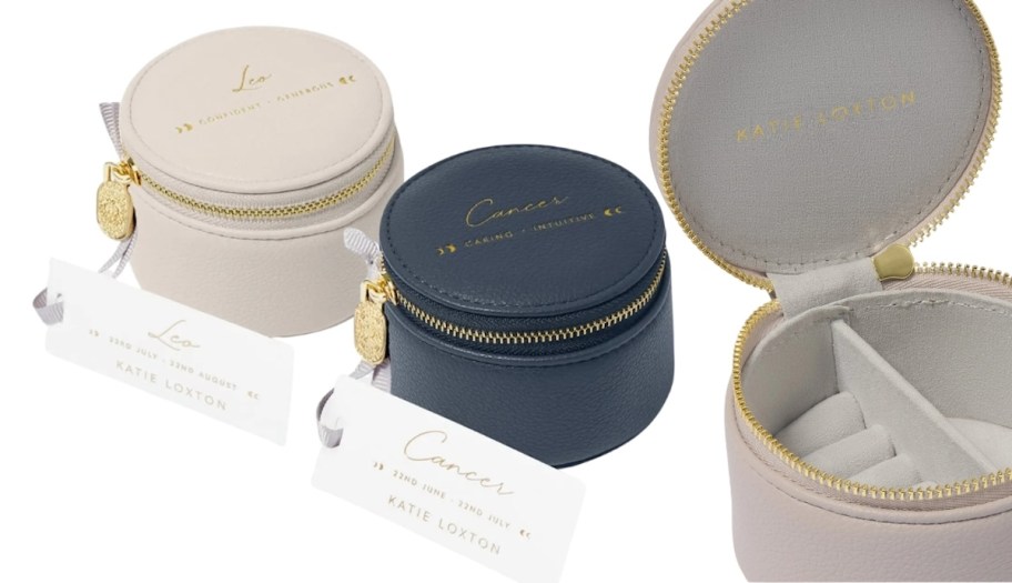 beige and navy zodiac jewelry boxes on white background