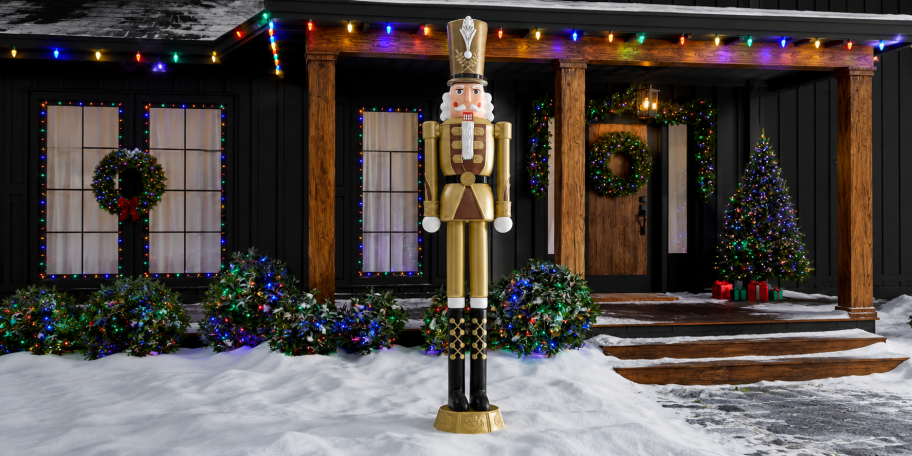 gold nutcracker outside of house 