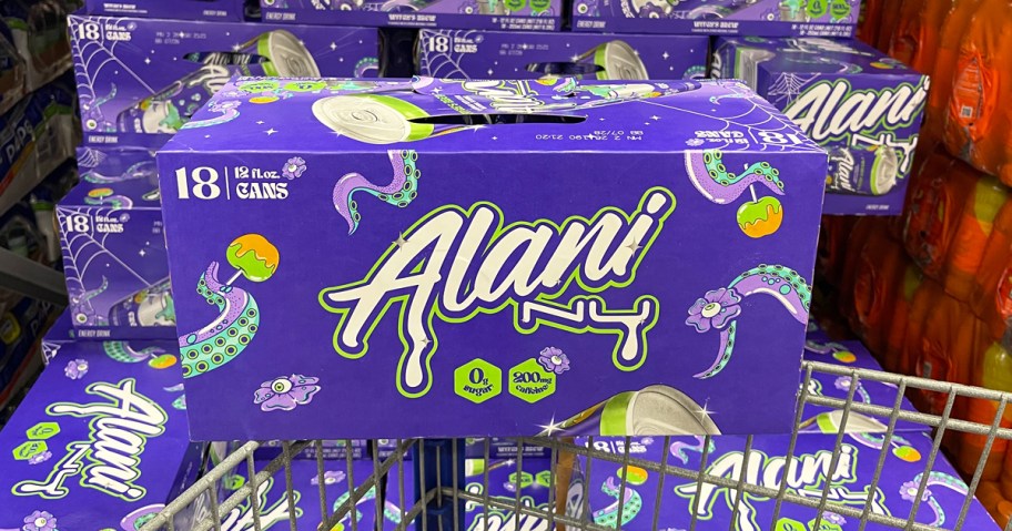 purple box of Alani Nu Witch's Brew energy drinks on top of shopping cart