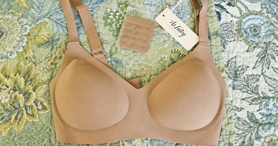 tan wireless bra on a blue and green quilt