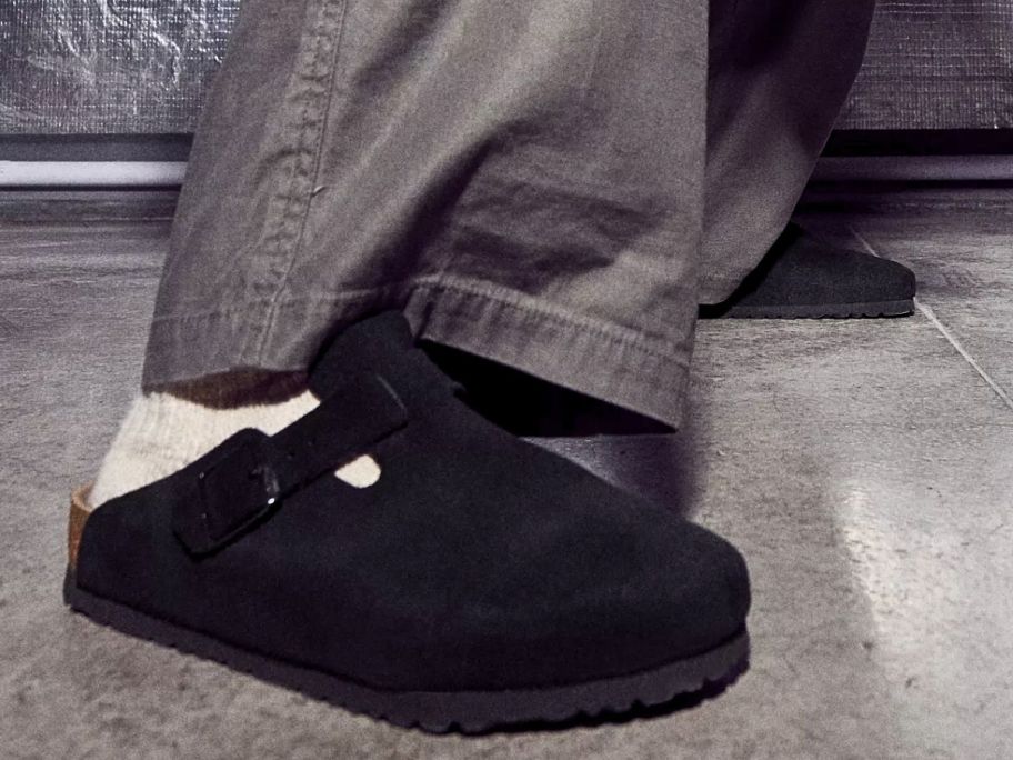 man's feet wearing Birkenstock Boston Clogs