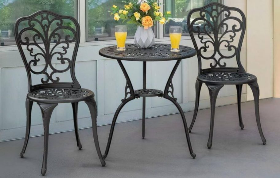 Bistro black three piece set with flowers on it 