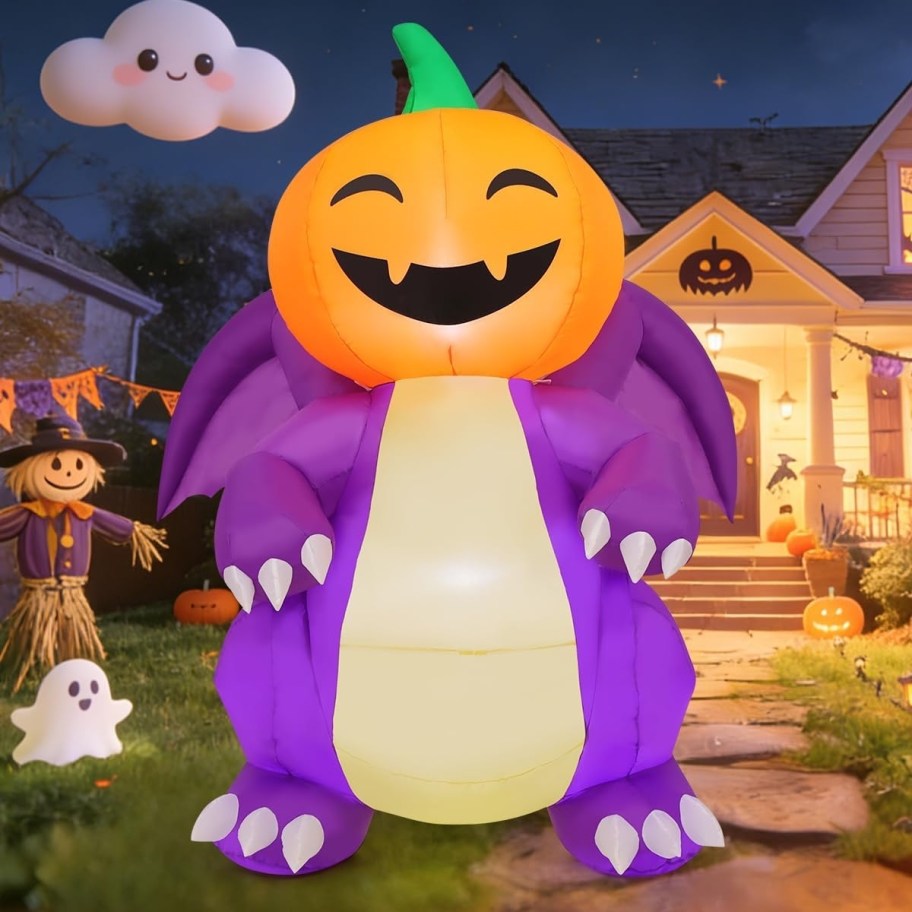 pumpkin head dragon inflatable in a yard