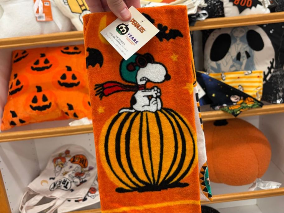 Celebrate Together 2-Piece Great Pumpkin Snoopy Kitchen Towel Set in hand in store