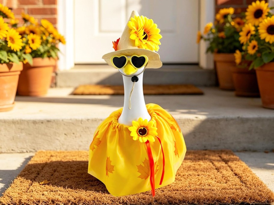 porch goose in a yellow sunflower outfit