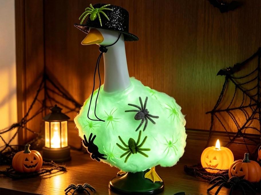 porch goose in a glow in the dark spider outfit