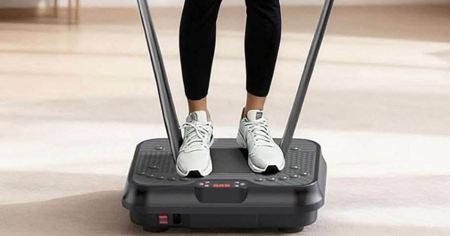 person standing on vibration plate exercise machine