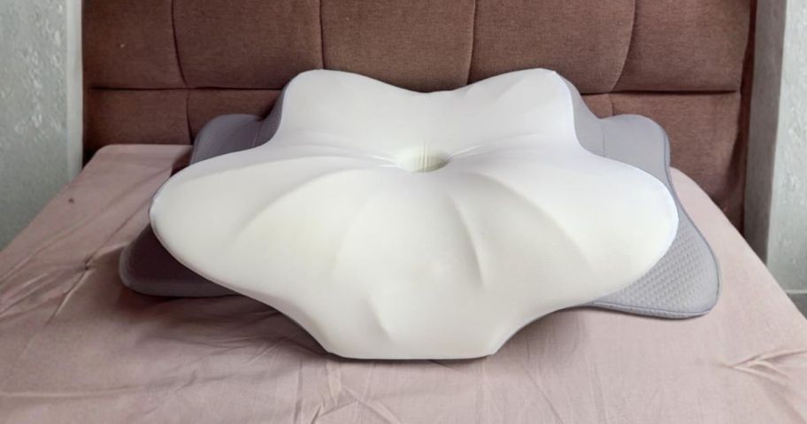 DONAMA Contour Cervical Neck Pillow on bed