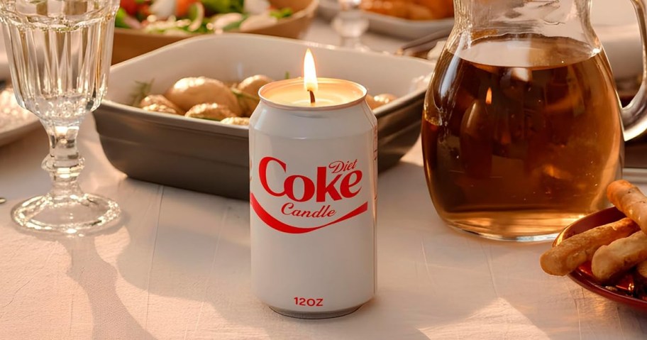 Diet Coke Candle on a table full of food