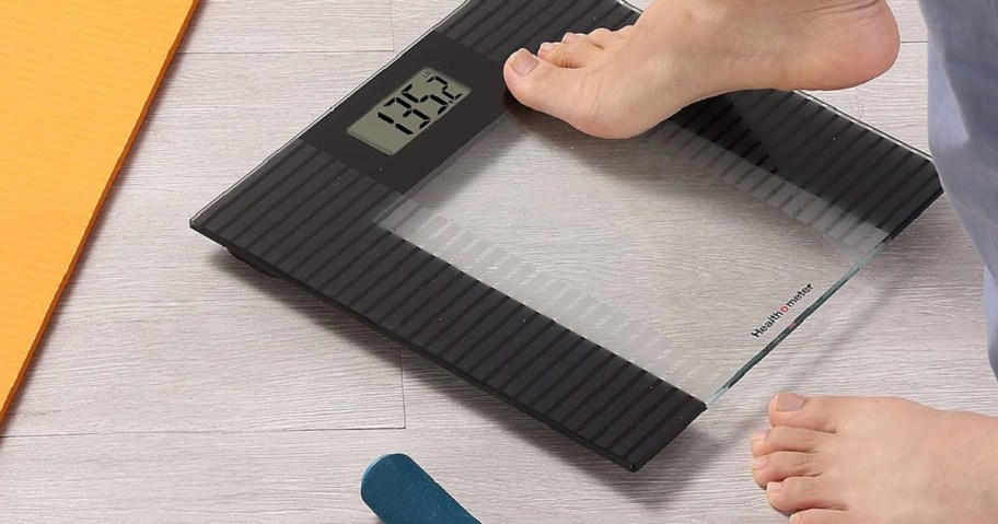 Feed stepping onto digital bathroom scale