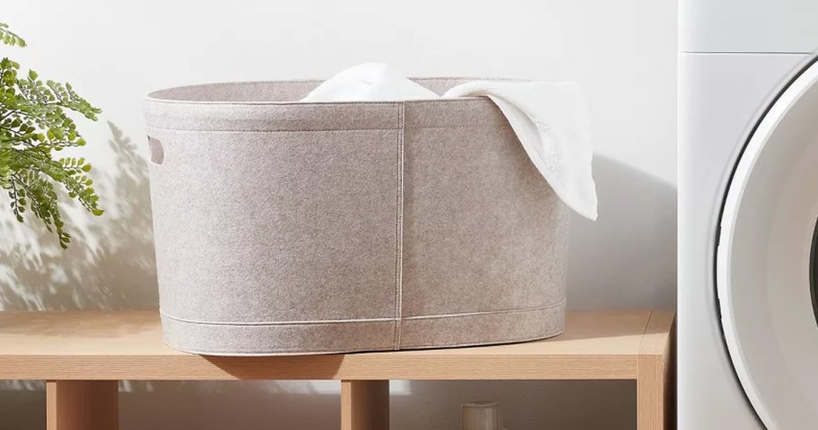 Felt Laundry Basket on shelving next to a washing machine