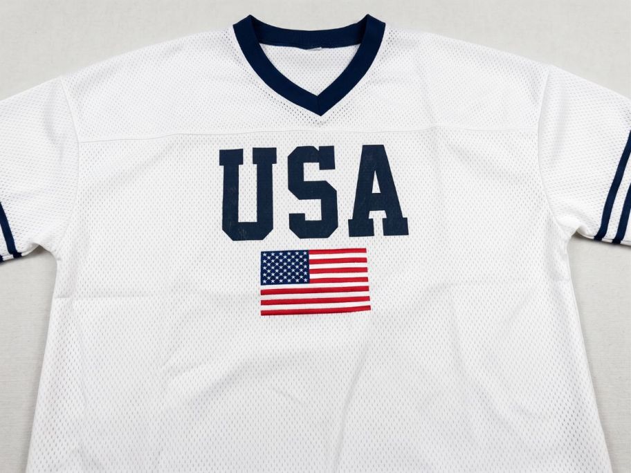 Forever 21 Women's Mesh Oversized USA Soccer Jersey Tee on table