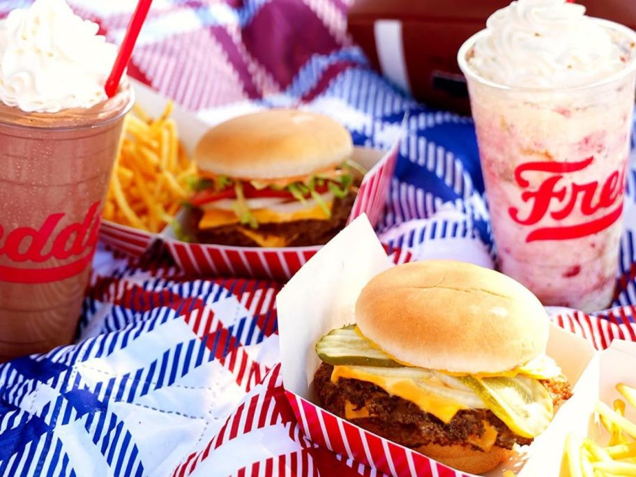 2 Freddy's Steakburgers and Shakes on a plaid blanket