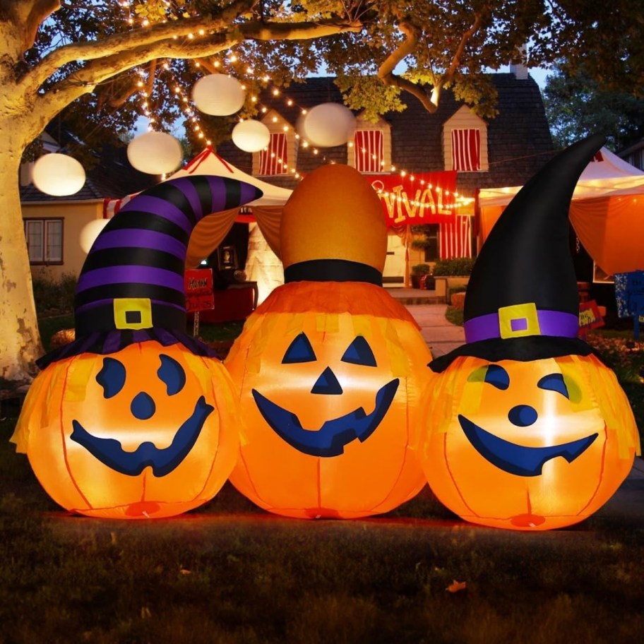 pumpkin trio inflatable in a yard