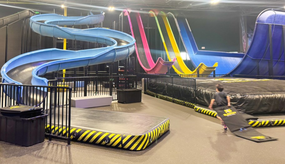 child running in indoor slide park