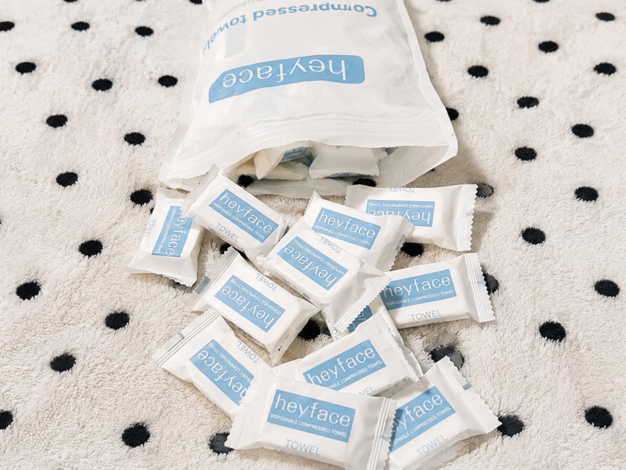 individually wrapped compressed towels coming out from their bag