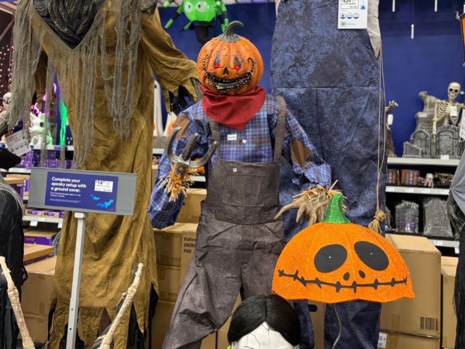 A talking pumpkin scarecrow animatronic on display at lowes.