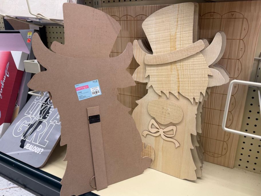 A wood highland Cow decoration at Hobby Lobby