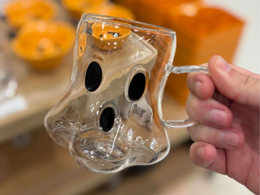 Hyde & EEK! Boutique Ghosty Glass Figural Mug in hand in store