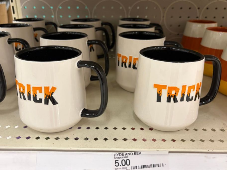 Hyde & EEK! Boutique Trick Treat Drinkware Mugs on shelf in store