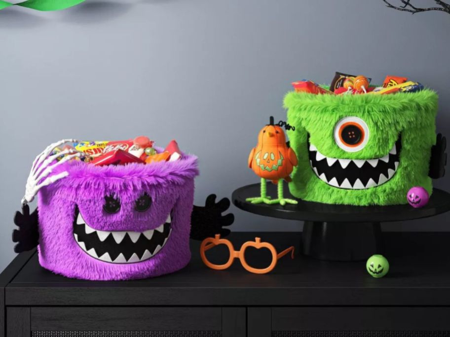 a purple and green Hyde and EEK! Boutique Monster Spider Web Basket on table