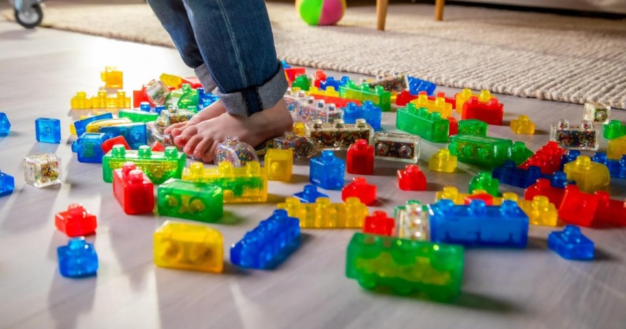 Colorful Jelly Blox building pieces spread across a playroom floor
