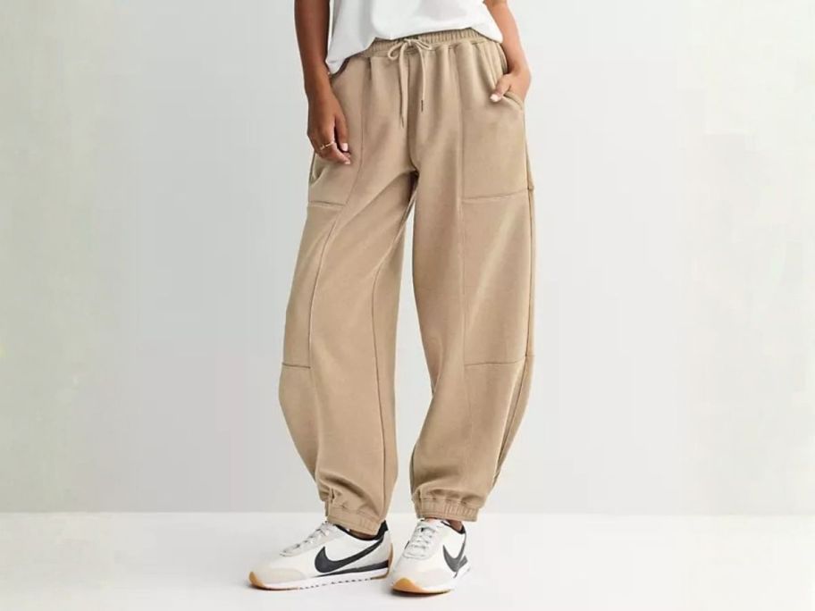 girl wearing Juniors' Pink Republic Fleece Barrel Leg Joggers