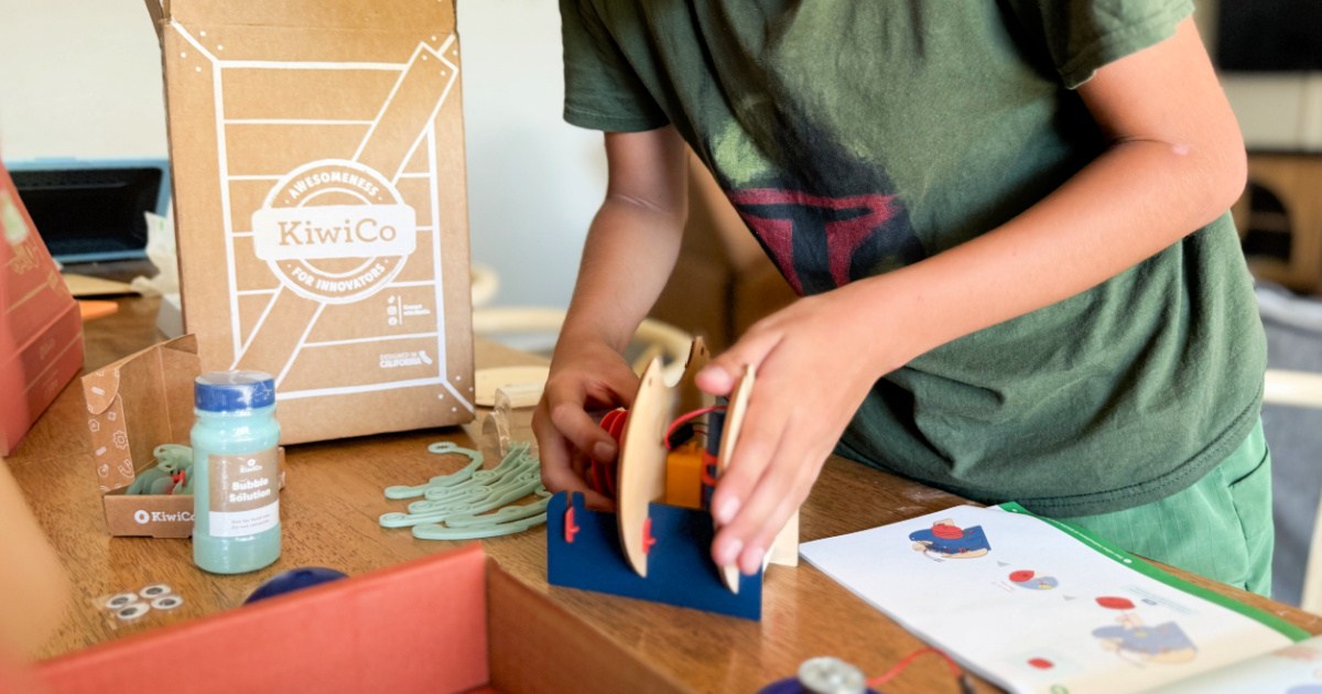 Little boy building an activity with the kiwi Co. crate box